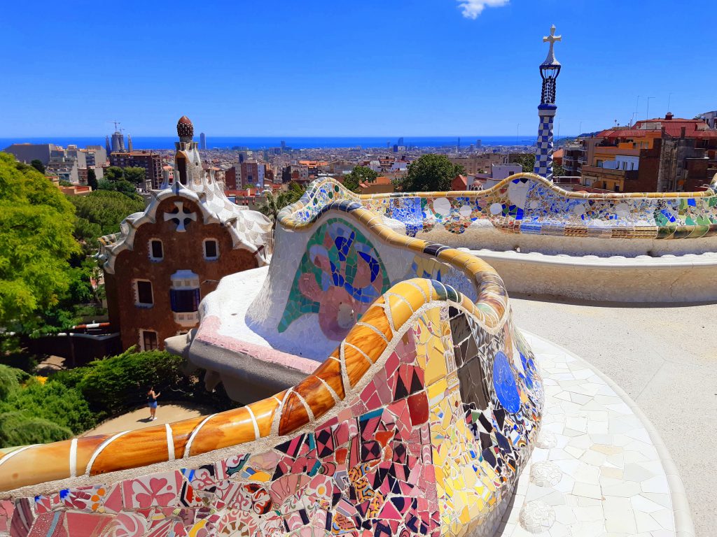 Parc Guell's iconic mosaic wall, made up of thousands of shards of coloured tiles